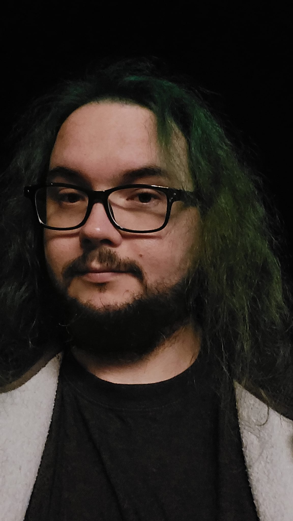 A man with green hair is at the beach after dark, photo 10